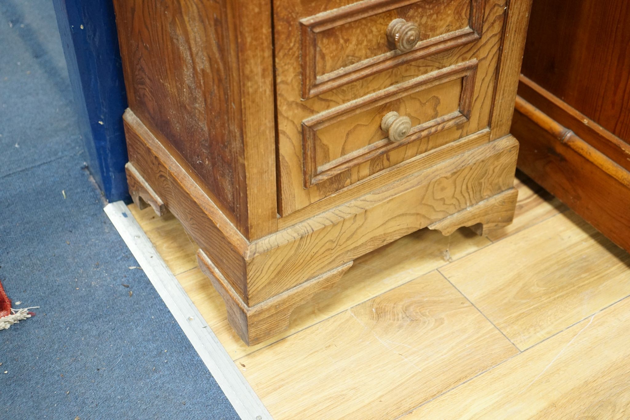 A 19th century French elm bedside cabinet with dummy drawer front, width 47cm, depth 36cm, height 76cm